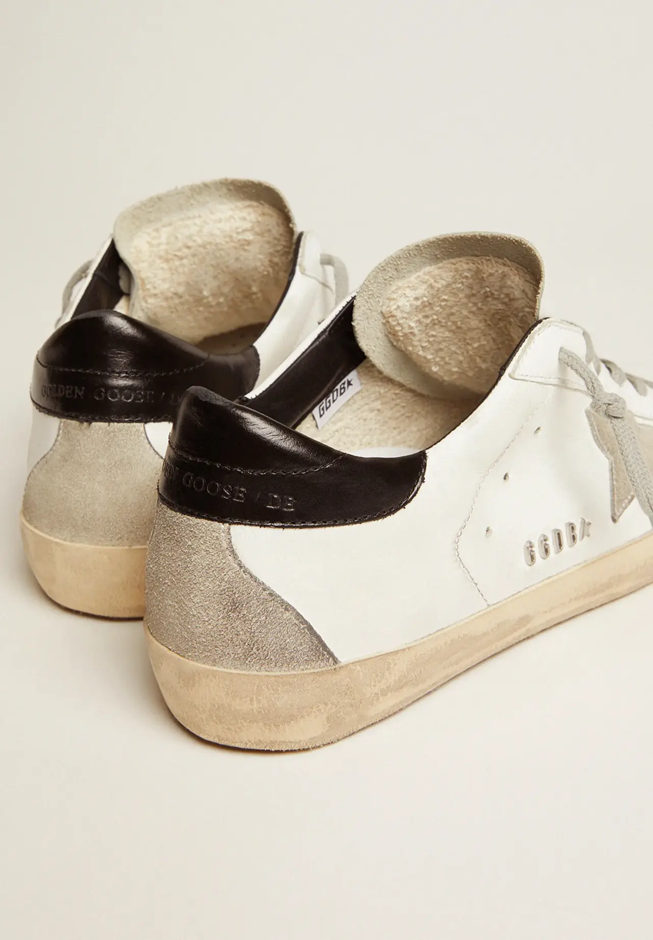Super-Star sneakers with black heel tab and metal studs lettering
