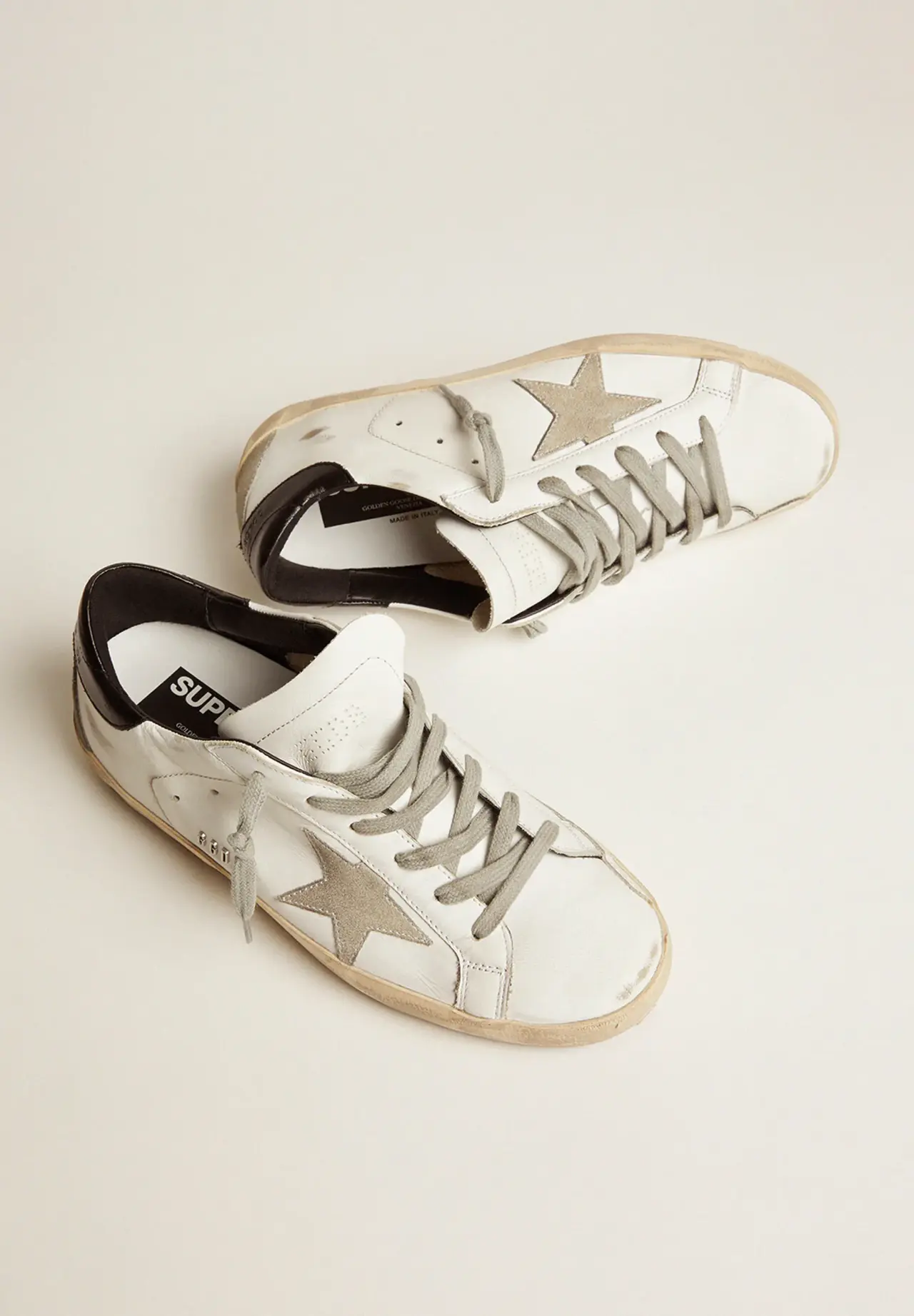 Super-Star sneakers with black heel tab and metal studs lettering